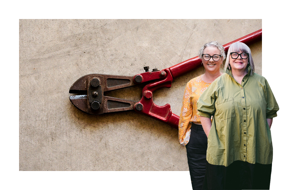 Pictured: Anthea Taylor and Amy Osborne standing smiling in front of an image of bolt cutters.